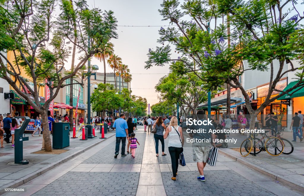 The Third Street Promenade in Santa Monica, California. Santa Monica / CA - July 26 2015: View of the Third Street Promenade, a pedestrian mall shopping, dining and entertainment complex in the downtown area of Santa Monica, California. Shopping Mall Stock Photo