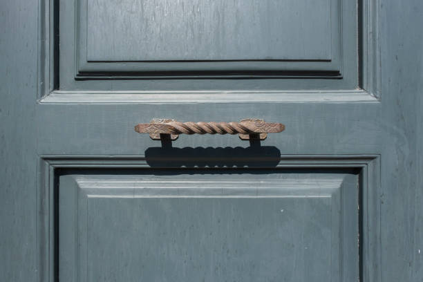 istock Door handle antique on a wooden blue door 1273285228