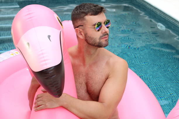 istock Attractive muscular man in the pool 1273285369