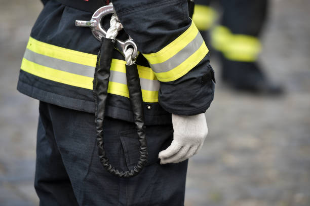 istock Fire fighters uniform detail with carabiner and harness during ceremony 1273285521