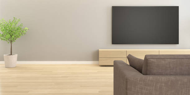 istock 3D rendering of modern living room with TV screen on grey wall with sofa. 1273292285