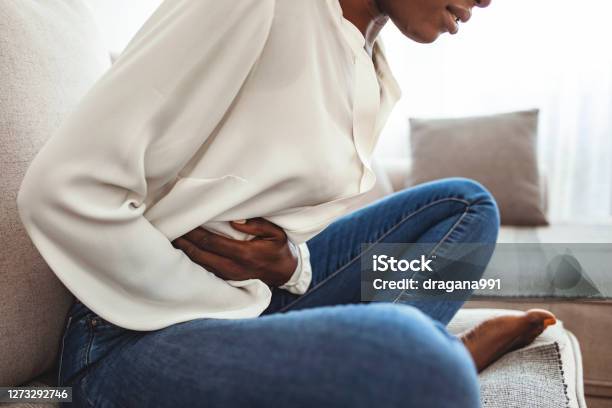 Ouch My Tummy Stock Photo - Download Image Now - Stomachache, Women, One Woman Only