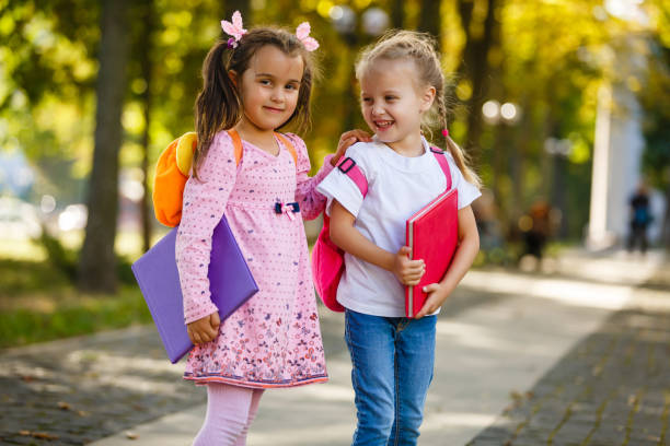 istock Adorable little schoolgirl feeling extremely excited about going back to school 1273293082