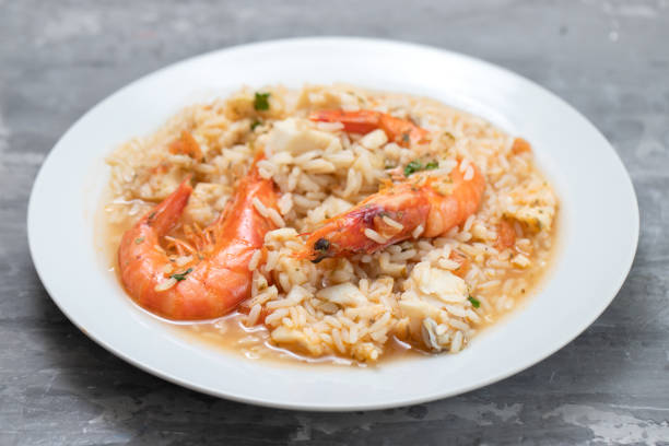istock rice with fish and seafood in white plate on ceramic background 1273294197