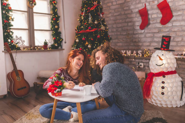 istock Couple writing a letter to Santa 1273295396