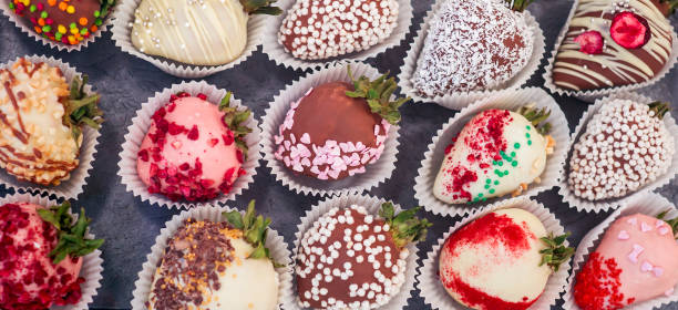 istock Various handmade chocolate candies shape of strawberries. 1273296391