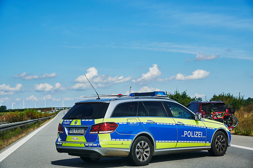 Freeway 20, Germany - August 30, 2020: Police car during a rescue operation on a motorway in Germany.