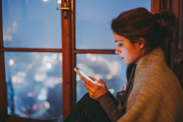 istock Woman texting at home 1273299243