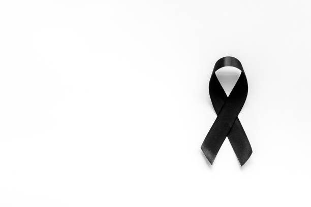 istock Black ribbon as mourning symbol top view 1273300465
