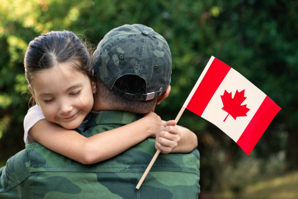 istock Canadian Soldier And His Daughter 1273300722