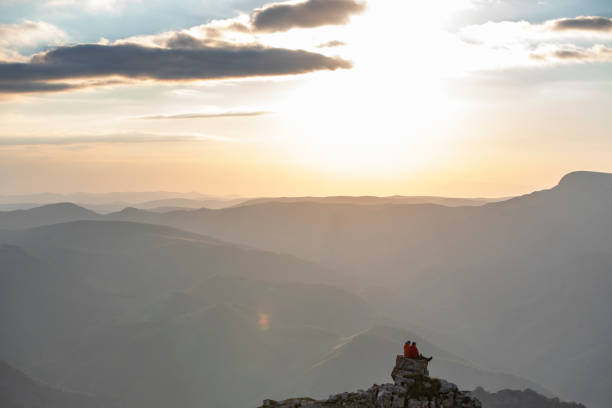 istock Young couple hiking at the mountains 1273303751