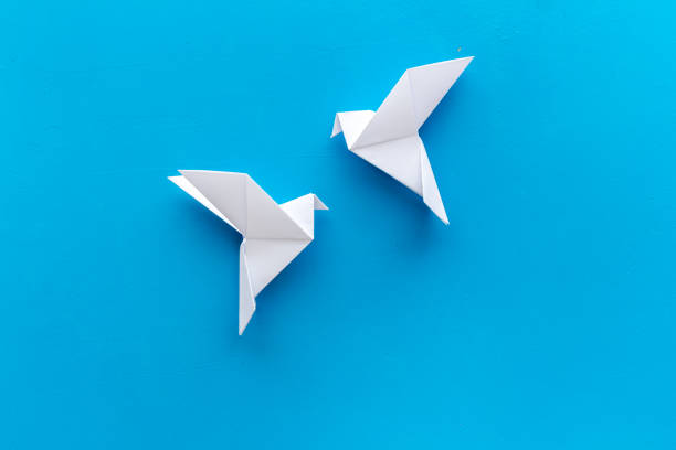 istock Origami birds are flying, overhead top view 1273303987