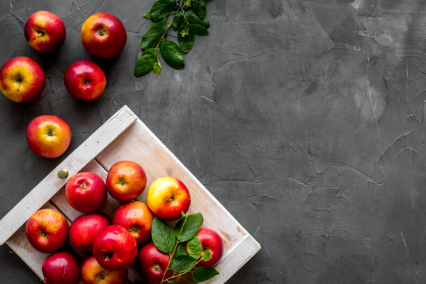 istock Frame of red apples with green leaves top view 1273304438