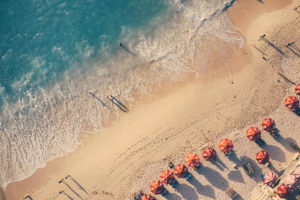 istock Beach umbrellas and blue ocean. Beach scene from above 1273305577