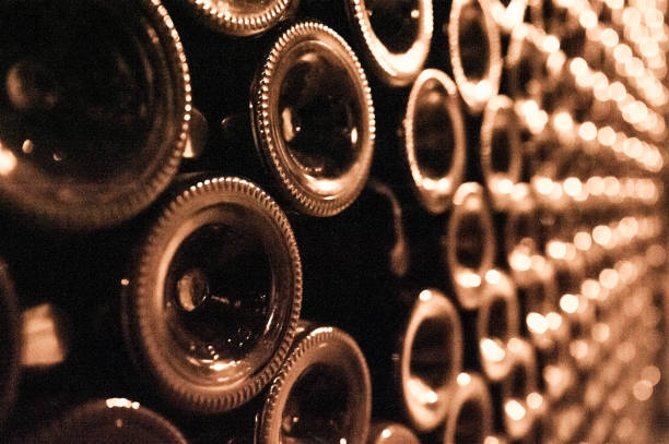 Champagne Cellar Endless bottles, one broken leaving a negative space champagne region photos stock pictures, royalty-free photos & images
