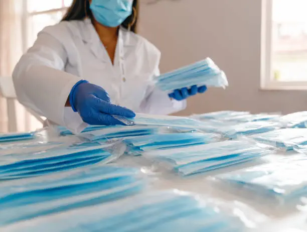 With the global spread of novel coronavirus pneumatia, medical mask production workers are organizing masks to prepare for the epidemic.COVID-19 outbreak