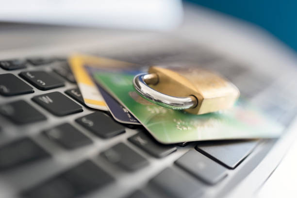 Computer internet credit card security with padlock on laptop Computer internet credit card security concept with padlock identity theft photos stock pictures, royalty-free photos & images
