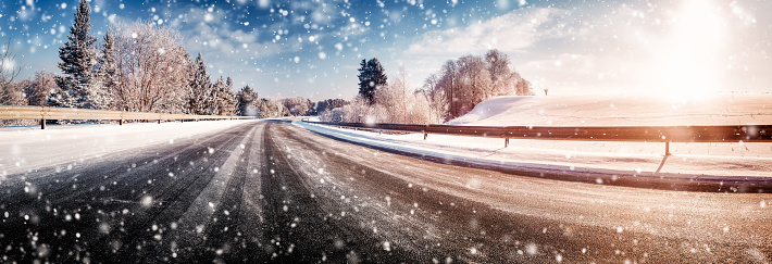 Car on winter road covered with snow