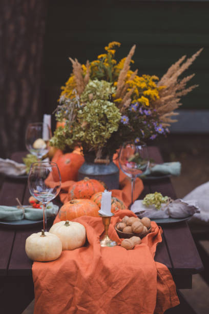 istock Fall themed holiday table setting arrangement for a seasonal party, selective focus 1273307998