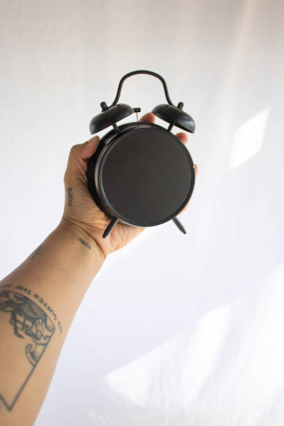 istock a person holding an entire black watch 1273309000