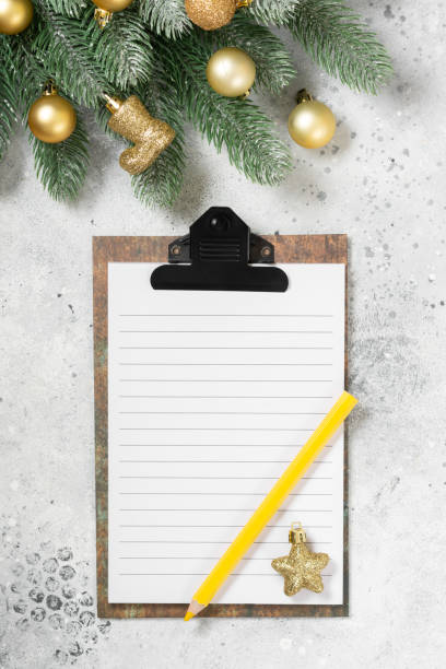 istock Christmas or New year holiday background with an open blank Notepad, spruce branches and traditional Christmas decorations. A checklist or a letter to Santa. Top view with copy space 1273309396