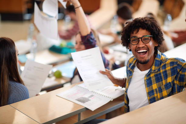 istock Happy male student with his success on exam 1273311015