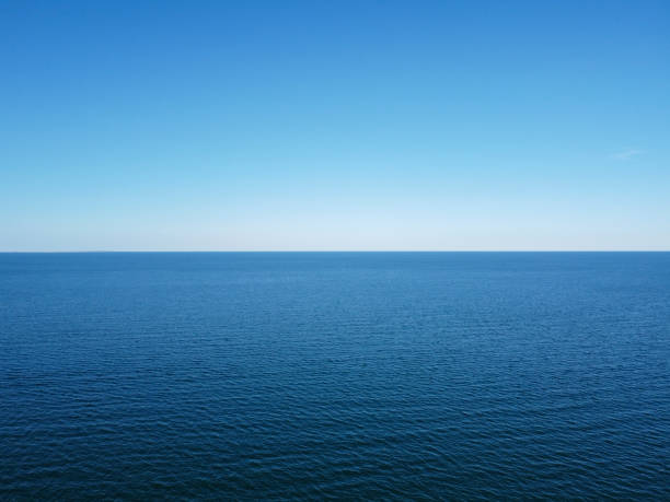 istock Blue horizon where the cloudless sky and the blue sea converge. 1273311155