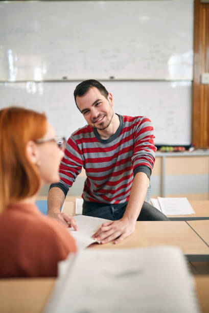 istock Male student in amphitheater with female 1273311903