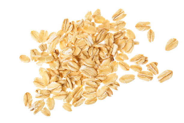 istock oat flakes isolated on white background. Top view 1273315690