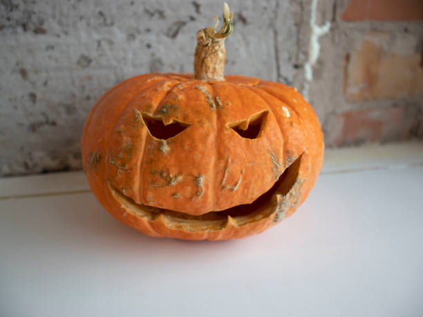 istock Evil pumpkin on a dark background for Halloween 1273315801