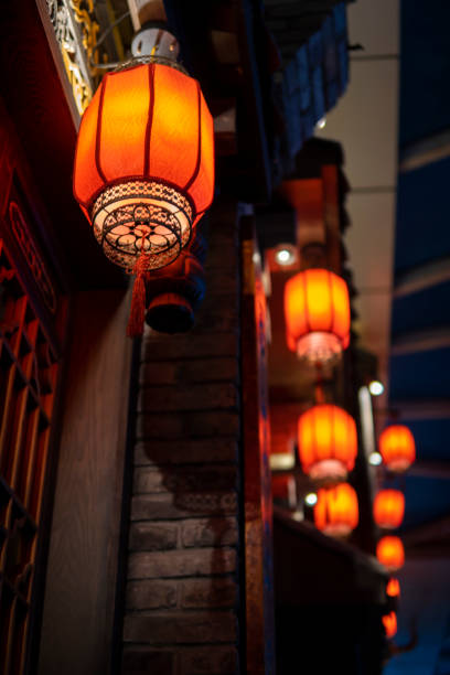 istock Red lanterns hanging in an ancient Asian town 1273321150