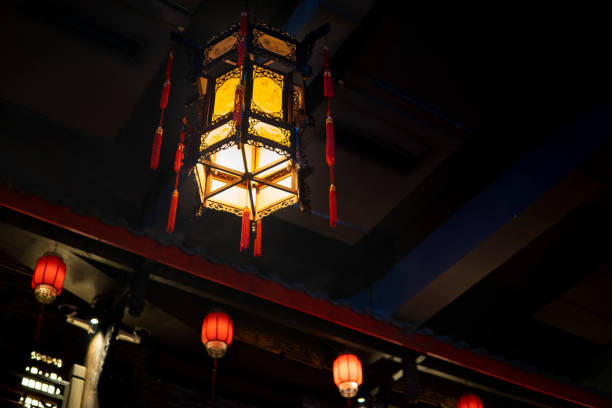 istock Red lanterns hanging in an ancient Asian town 1273321276
