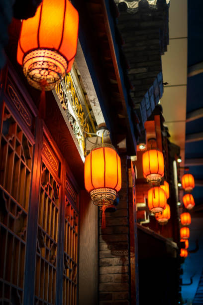 istock Red lanterns hanging in an ancient Asian town 1273321331