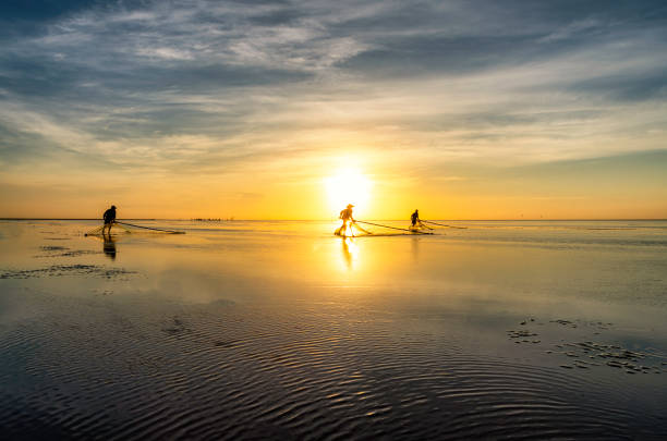 istock Shadow fishermen in the early morning. 1273321935