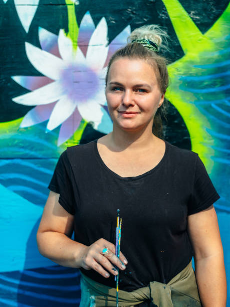 istock Female mural artist at work 1273321953