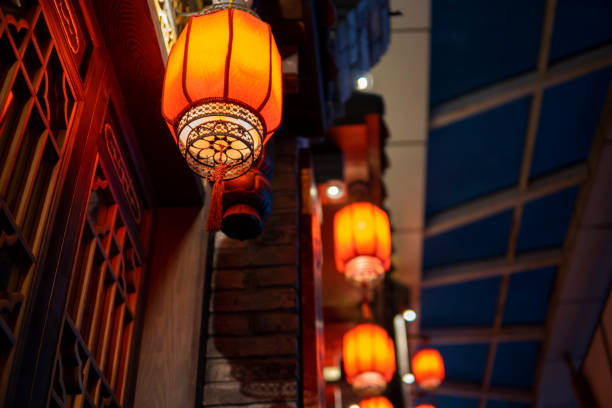 istock Red lanterns hanging in an ancient Asian town 1273322036