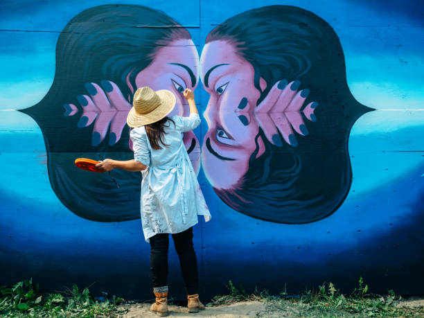 istock Female mural artist at work 1273322718