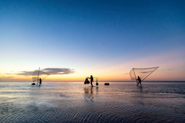 istock Shadow fishermen in the early morning. 1273323016