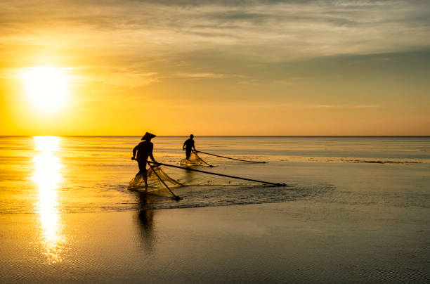 istock Shadow fishermen in the early morning. 1273324253