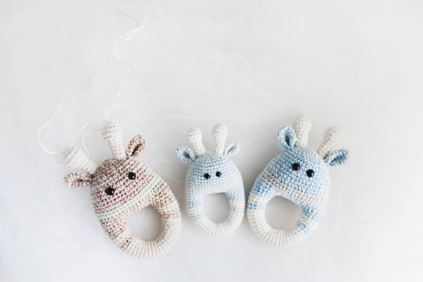 istock Simple knitted baby toys on white background. 1273324791
