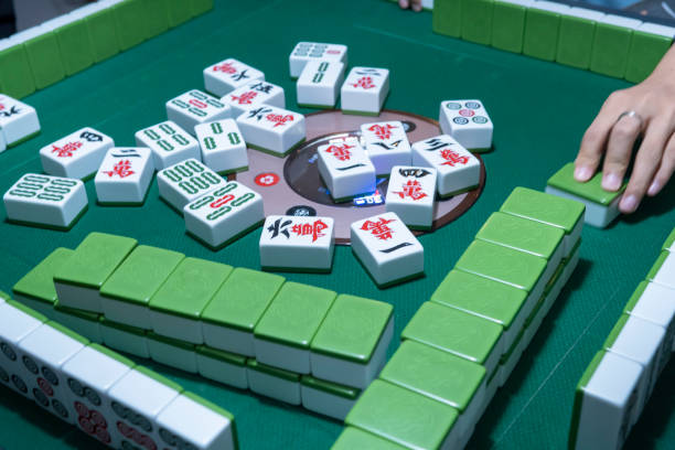 istock People playing the Chinese mahjong 1273330359
