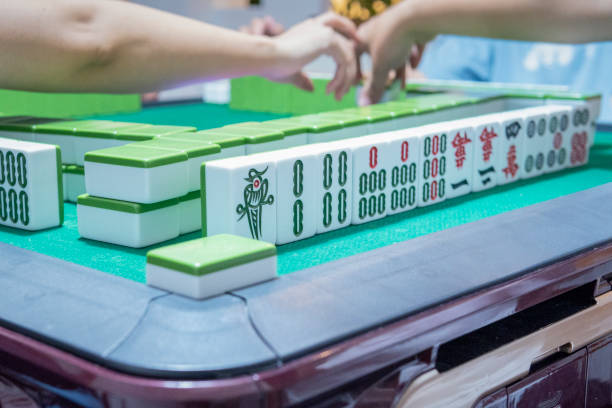 istock People playing the Chinese mahjong 1273330388