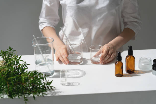 Beauty cosmetic research and development concept. The scientist, dermatologist testing the organic natural cosmetic product in the laboratory. Vials, glass laboratory flasks. Beauty cosmetic research and development concept. chemical formula stock pictures, royalty-free photos & images