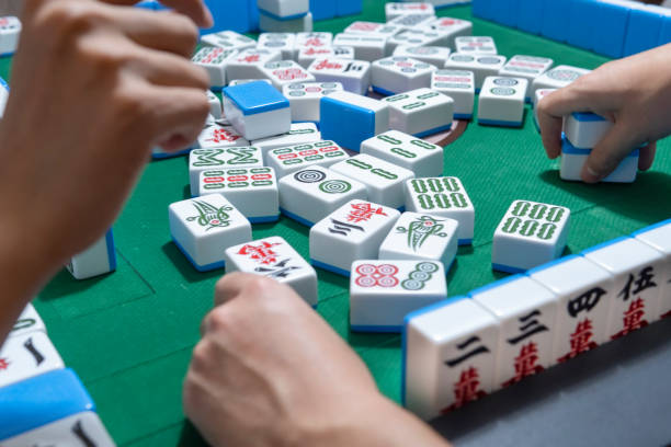 istock People playing the Chinese mahjong 1273330701