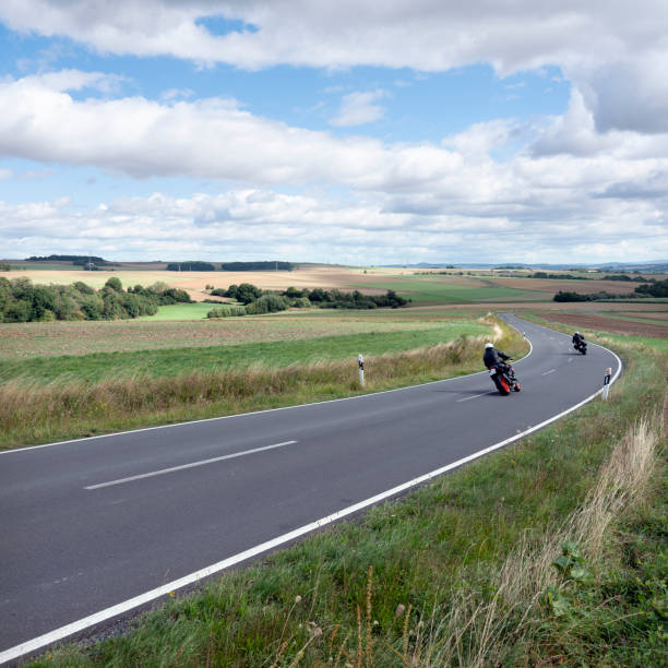 istock motorcycles on country road in german eifel 1273331334