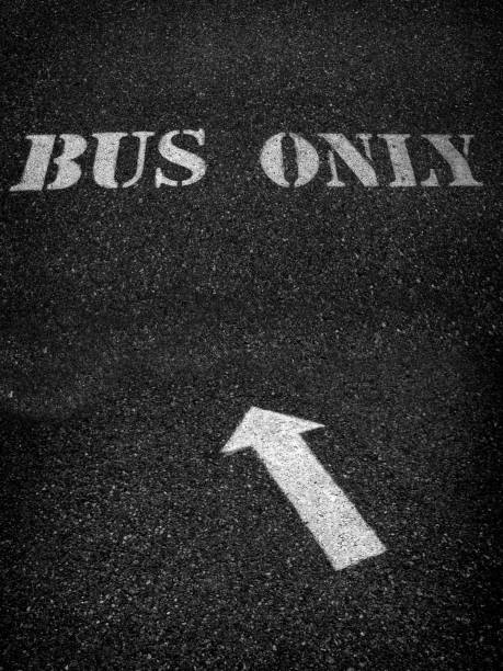 istock Bus only sign painted white on roadway asphalt for direction 1273331566