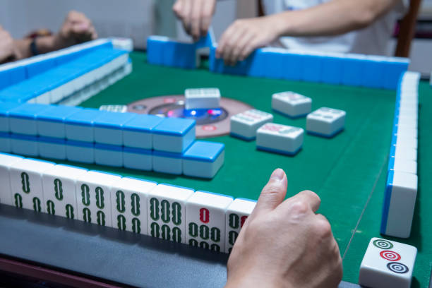 istock People playing the Chinese mahjong 1273331761