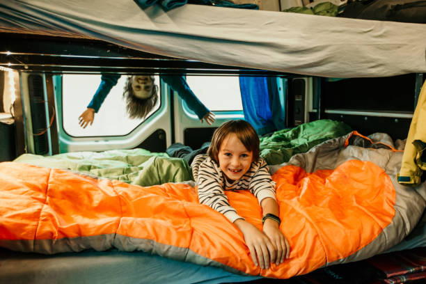 istock Children, having fun in camper van while heavy raining outdoors, playing and making mischiefs 1273331821