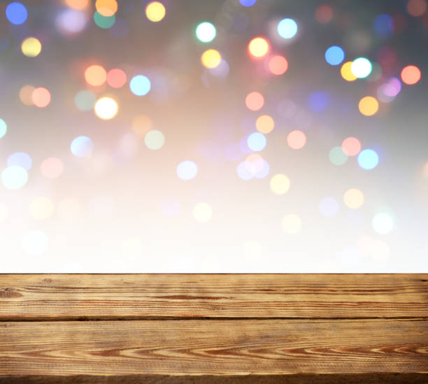 istock abstract background with bokeh light and wooden background 1273335929
