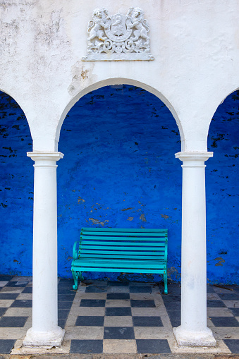 Portmeirion, Wales - September 1st 2020: A bench in the quayside Loggia, in the village of Portmeirion in North Wales, UK.